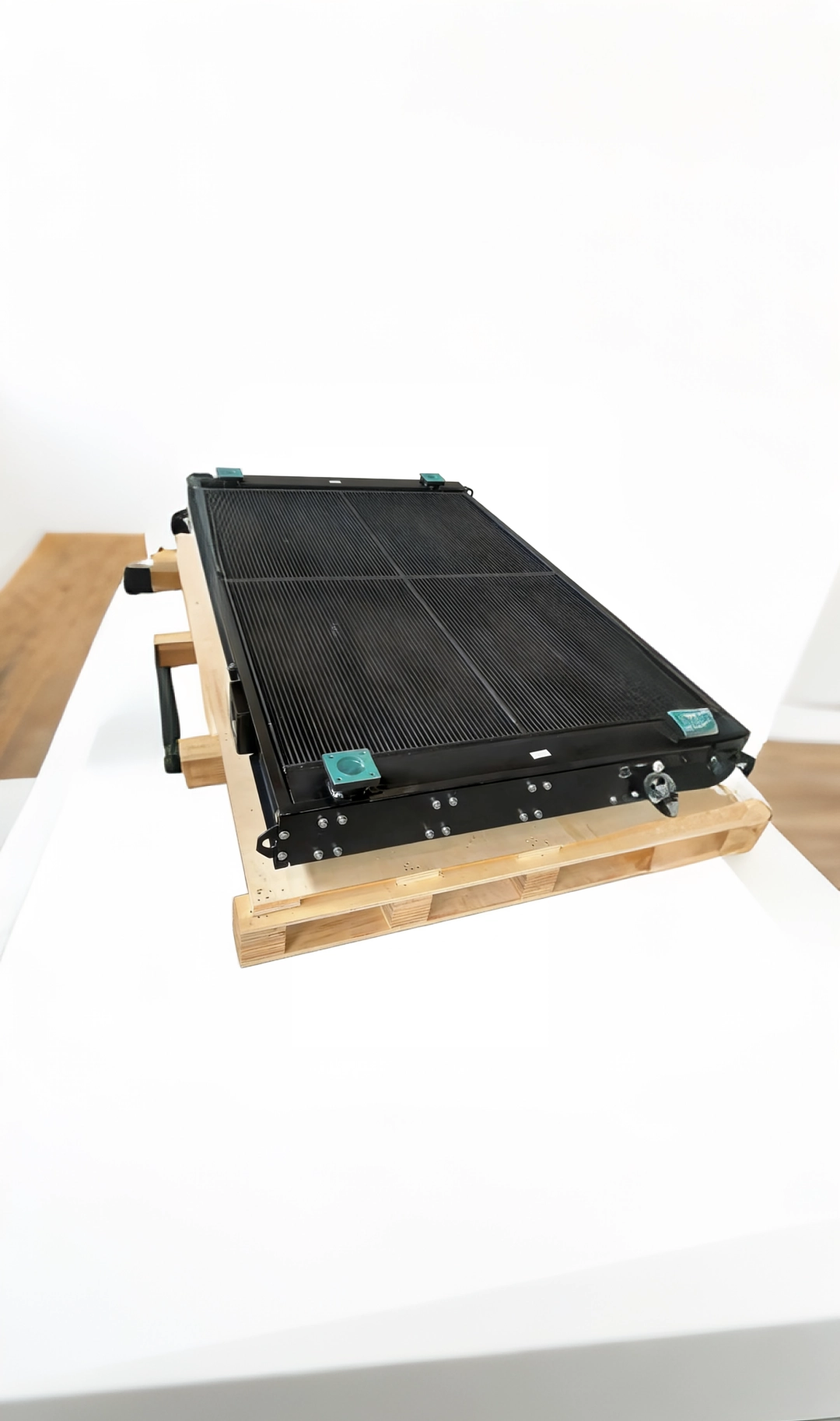 Finished railway locomotive oil coolers secured on heavy-duty wooden pallet, ready for international export shipping