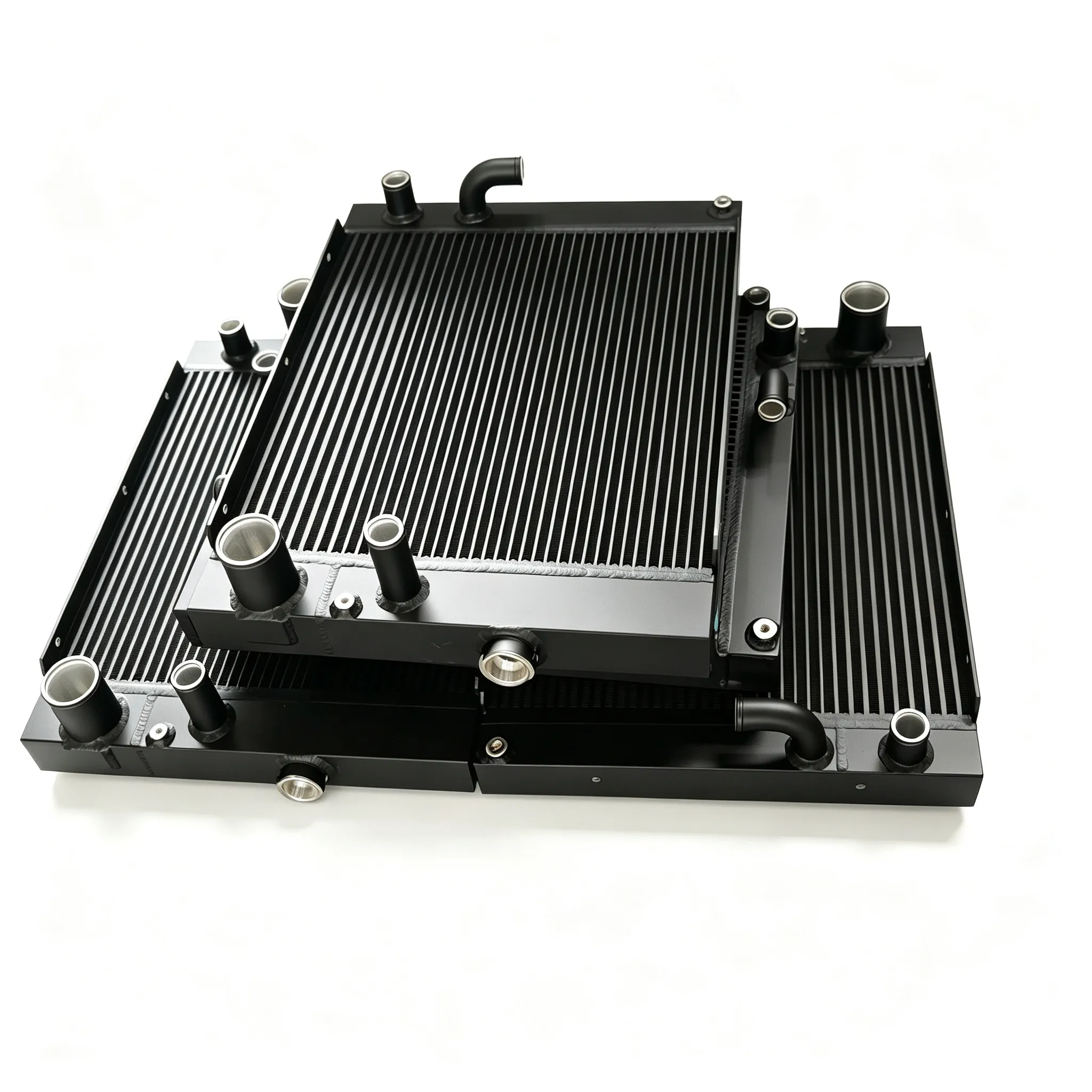 Batch of custom-made black aluminum oil coolers with diverse inlet and outlet pipe configurations.
